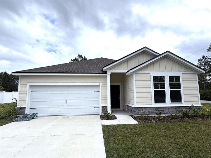 Front exterior of a new home in , Palm Coast, FL, highlighting curb appeal (Image 1). Front exterior of a new home in , Palm Coast, FL, highlighting curb appeal (Image 1).