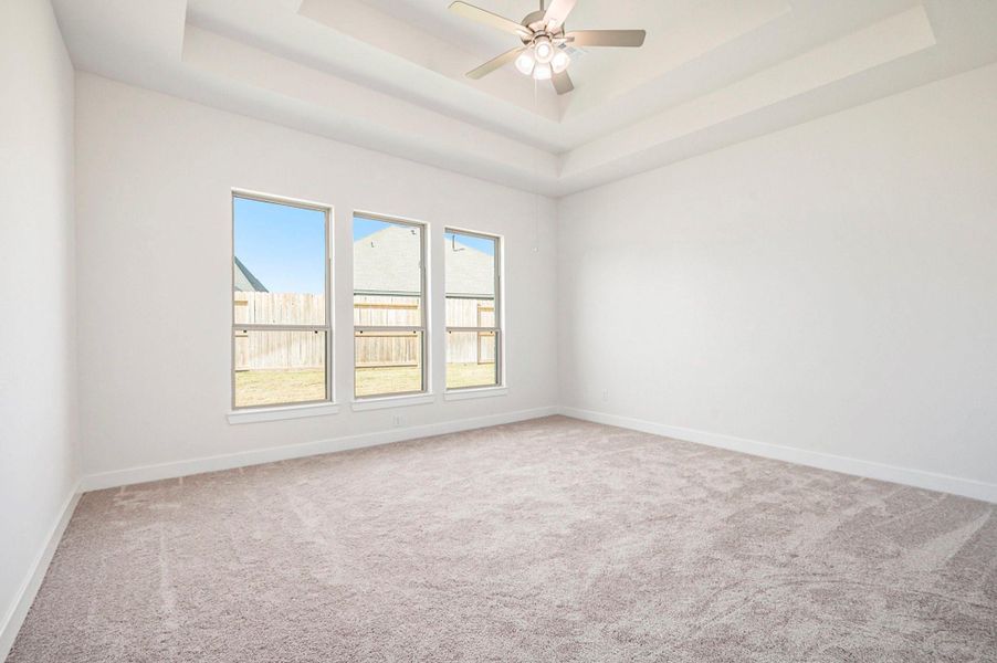 The primary suite offers a true retreat with two large walk-in closets and a luxurious ensuite bath.