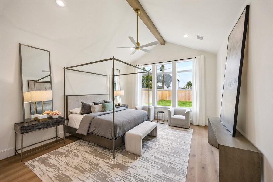 Spacious primary retreat with vaulted ceilings and wonderful natural light (first floor)