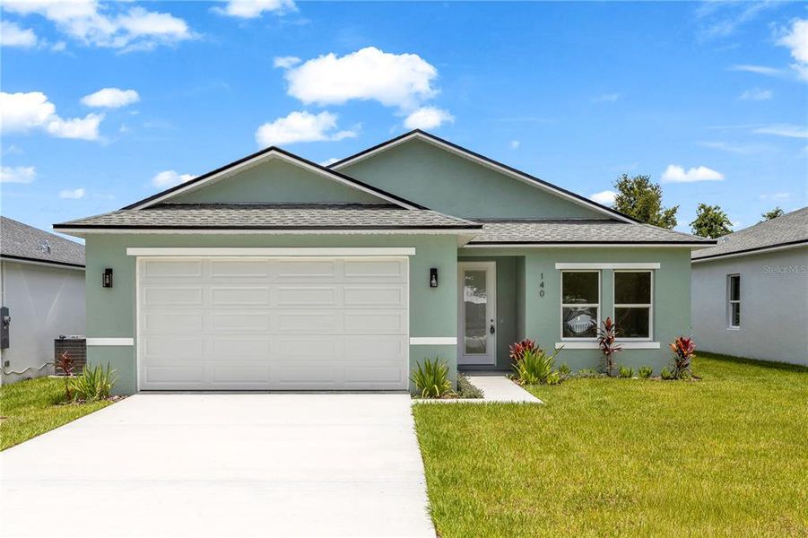 Front exterior of a new home in , Osteen, FL, highlighting curb appeal (Image 2). Front exterior of a new home in , Osteen, FL, highlighting curb appeal (Image 2).