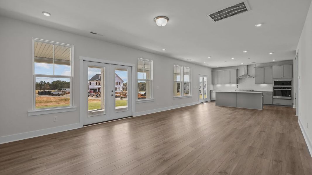 Burton Design open floor concept kitchen, dining, and family room. at Lakeside Glen by premier builder DRB Homes in York, SC. Burton Design open floor concept kitchen, dining, and family room. at Lakeside Glen by premier builder DRB Homes in York, SC.