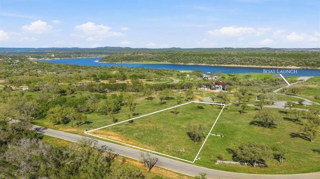 A generous lot offering ample space, featuring a gentle slope towards a beautiful water view.