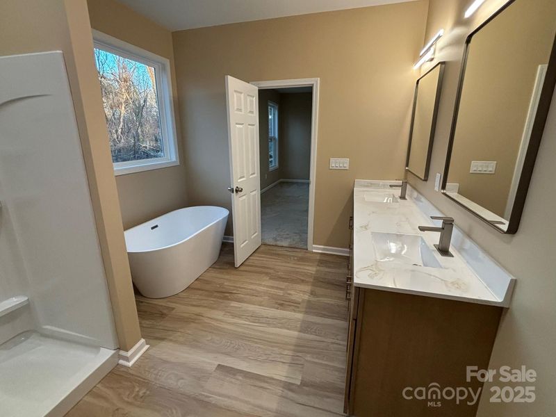 Spacious primary bath with custom lighting. Spacious primary bath with custom lighting.