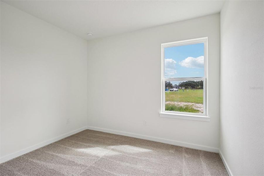 Spacious, unfurnished interior of a new home in Grasslands West, Lakeland (Image 12).