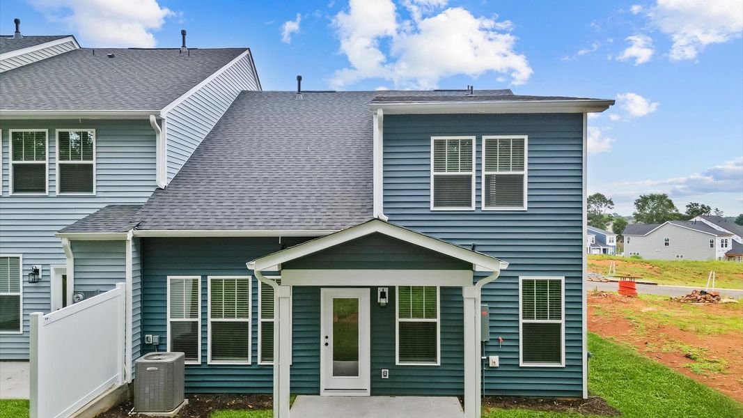 Front exterior of a new home in Aspen Ridge, Lyman, SC, highlighting curb appeal (Image 21).