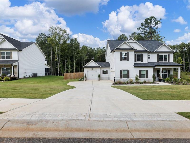 Front exterior of a new home in , Bethlehem, GA, highlighting curb appeal (Image 22).