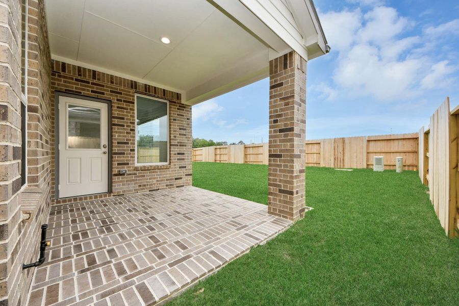 Experience outdoor living at its finest on this expansive covered patio, thoughtfully designed for BBQs and delightful outdoor dining. Sample photo of completed home with similar floor plan. Actual colors and selections may vary. Experience outdoor living at its finest on this expansive covered patio, thoughtfully designed for BBQs and delightful outdoor dining. Sample photo of completed home with similar floor plan. Actual colors and selections may vary.