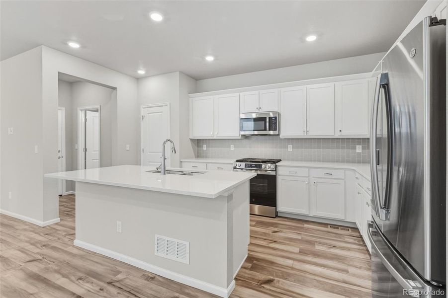 Furnished interior view inside a new home in Woodrose at Painted Prairie, Aurora (Image 6).