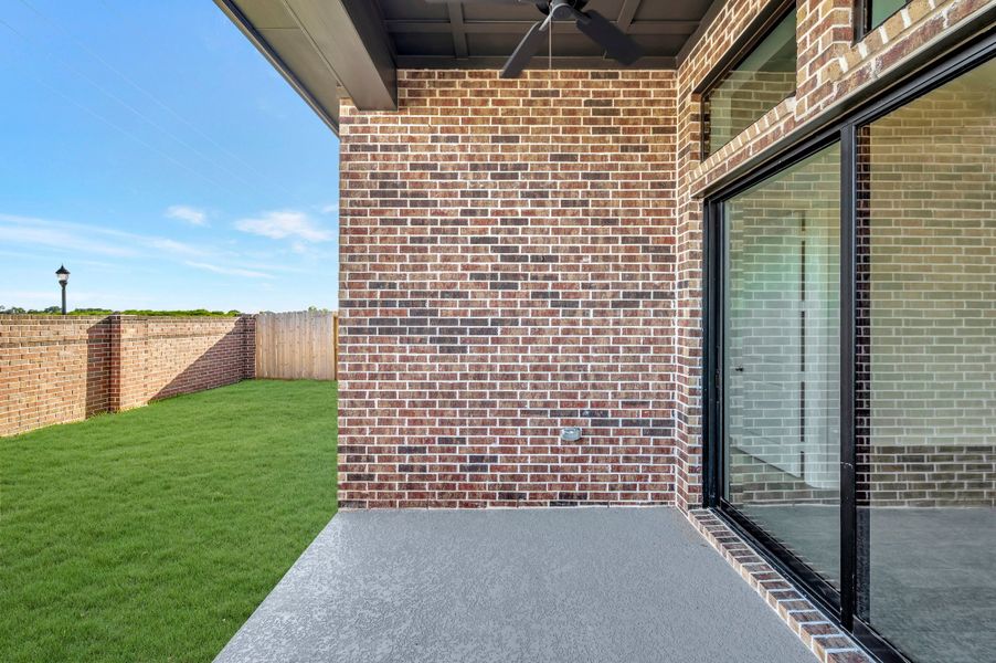 Exterior details and patio area of a home in Sienna - Grove Collection, Missouri City (Image 3).