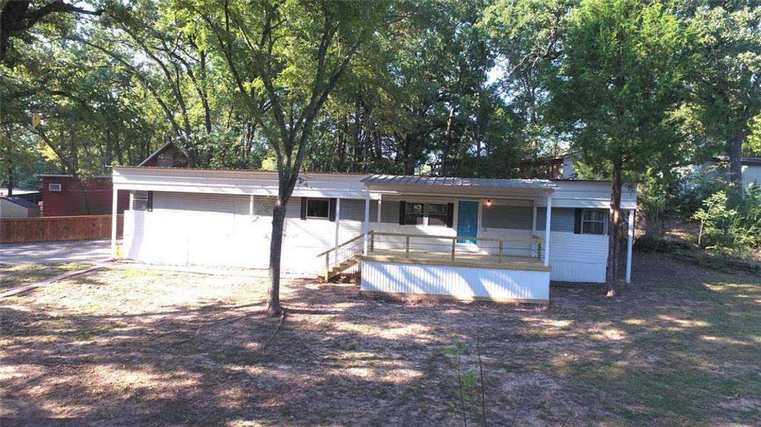 Front exterior of a new home in , Malakoff, TX, highlighting curb appeal (Image 16).