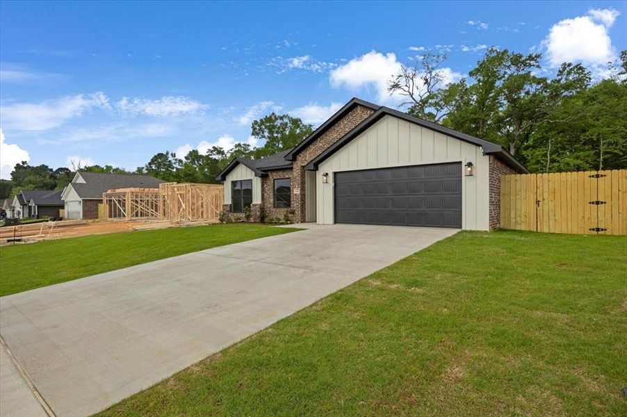Front exterior of a new home in , Lindale, TX, highlighting curb appeal (Image 20).