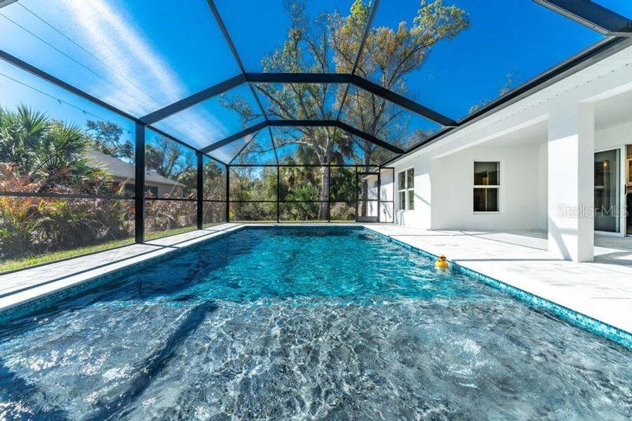 Exterior details and patio area of a home in , Port Charlotte (Image 24).