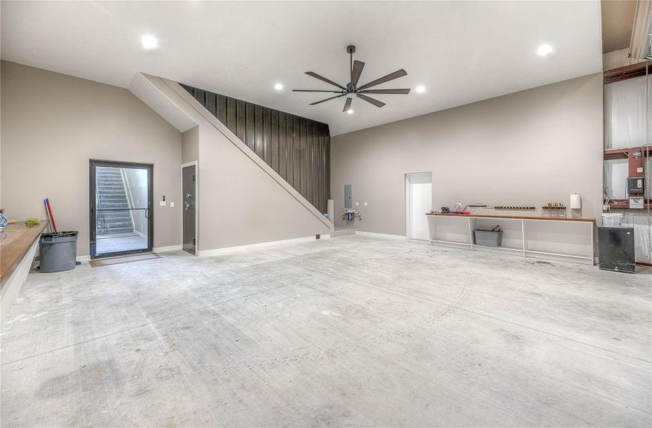 Inside of the shop of the 2 story barndominium with access to inside of house through the door or the stairs (Building B) Inside of the shop of the 2 story barndominium with access to inside of house through the door or the stairs (Building B)