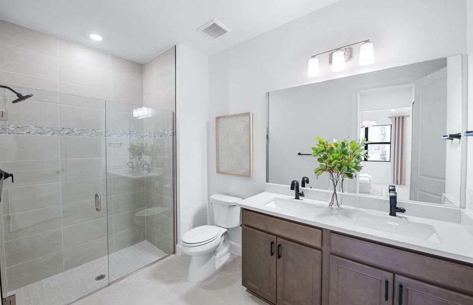 Owner's bathroom with dual sink vanity