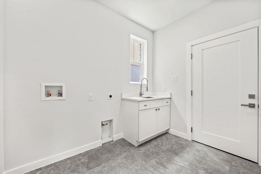 Laundry room with sink, light tile patterned floors, electric dryer hookup, and washer hookup