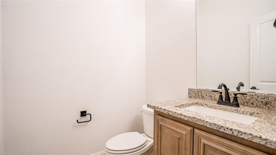 Home offers a half bath for guests. Home offers a half bath for guests.