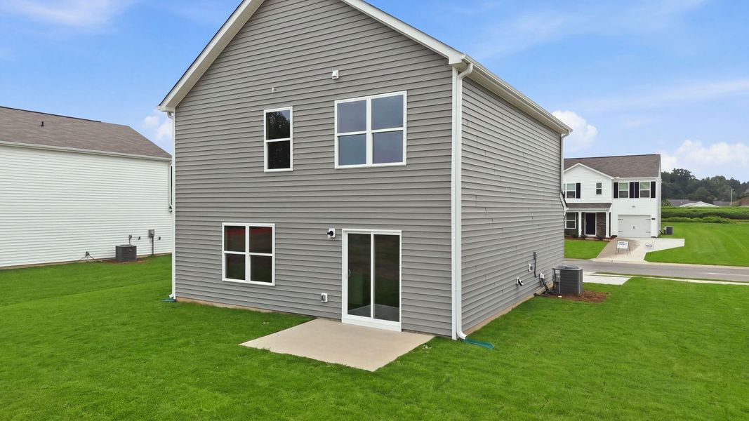 Exterior details and patio area of a home in Hobbs Farm, Ayden (Image 25).