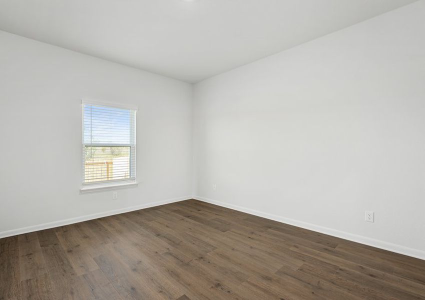 The master bedroom has a large window that lets in great, natural light.