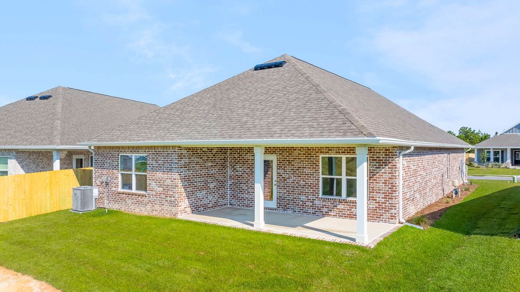 Front exterior of a new home in Owl's Head Farms, Freeport, FL, highlighting curb appeal (Image 2). Front exterior of a new home in Owl's Head Farms, Freeport, FL, highlighting curb appeal (Image 2).