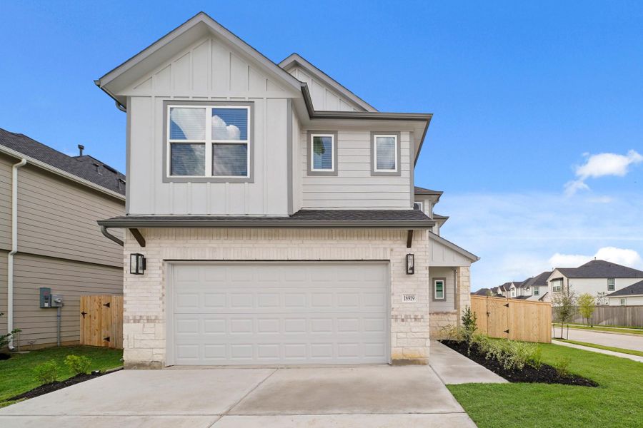 Front exterior of a new home in Grand Oaks Village, Houston, TX, highlighting curb appeal (Image 14). Front exterior of a new home in Grand Oaks Village, Houston, TX, highlighting curb appeal (Image 14).