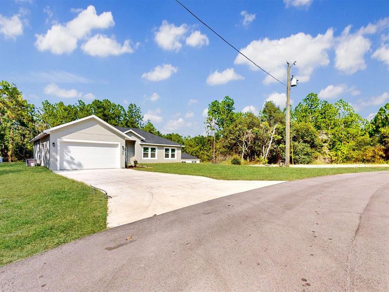 Front exterior of a new home in , Ocala, FL, highlighting curb appeal (Image 2). Front exterior of a new home in , Ocala, FL, highlighting curb appeal (Image 2).