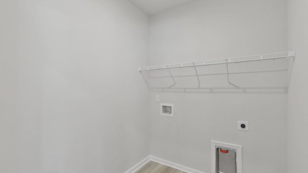 Experience sleek architecture in this single-family home laundry, blending style and functionality effortlessly.