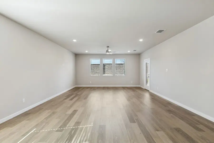 Living and Dining Room in the Holden home plan by Trophy Signature Homes – REPRESENTATIVE PHOTO