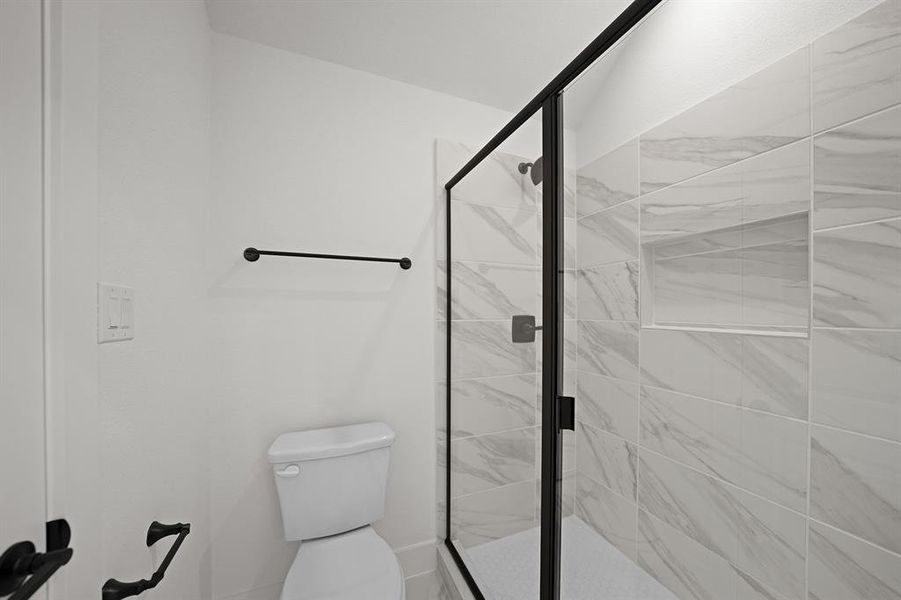 Bathroom with a shower stall Bathroom with a shower stall