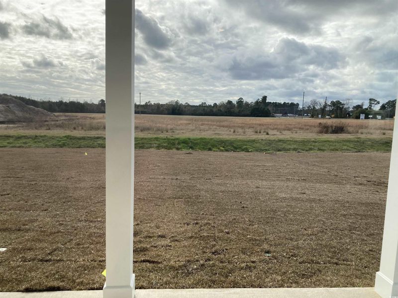 View of yard with a rural view