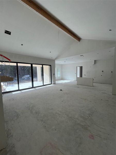 16'x8' slider doors at great room to patio with outdoor fireplace and kitchen