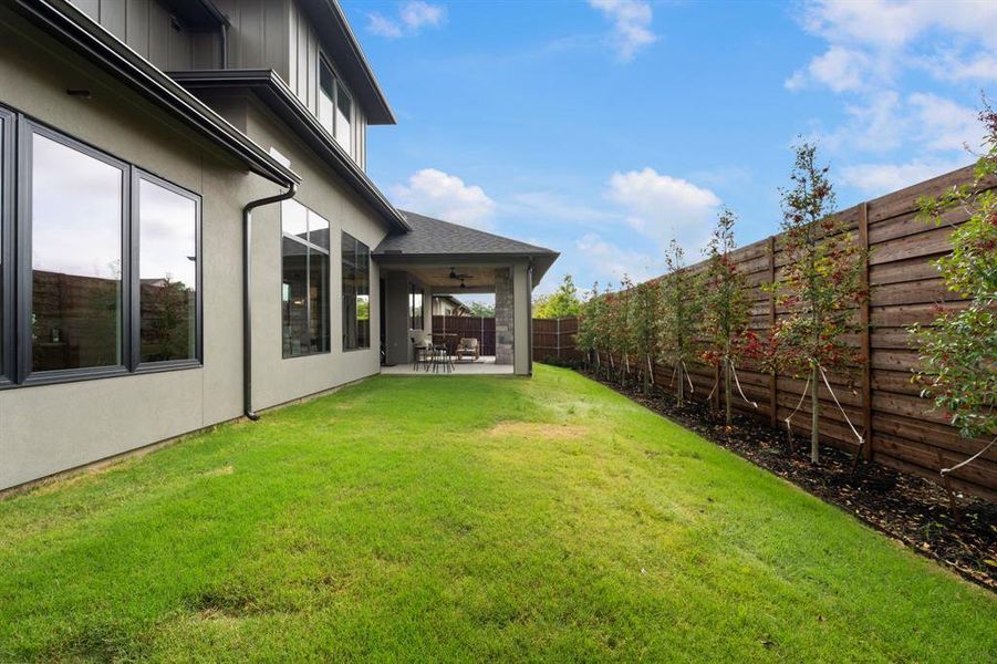 Fenced backyard featuring a fully enclosed patio area and yard fit for a pool Fenced backyard featuring a fully enclosed patio area and yard fit for a pool