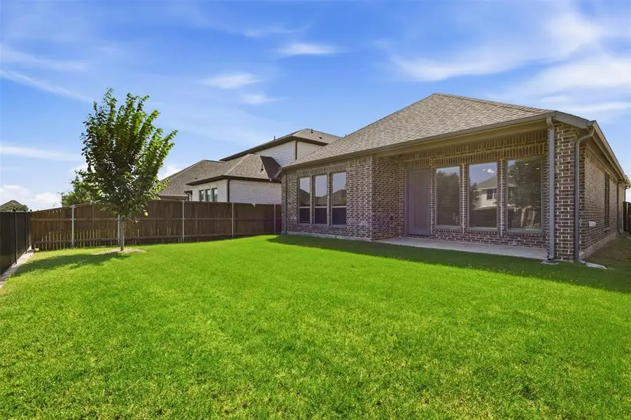 Exterior details and patio area of a home in Devonshire, Forney (Image 4).