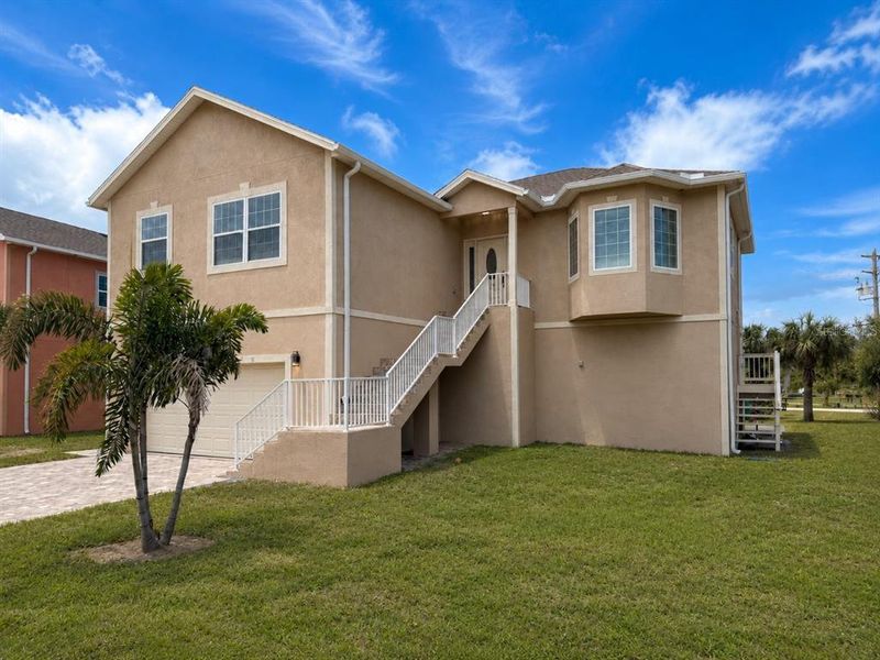 Front exterior of a new home in , Tarpon Springs, FL, highlighting curb appeal (Image 26). Front exterior of a new home in , Tarpon Springs, FL, highlighting curb appeal (Image 26).