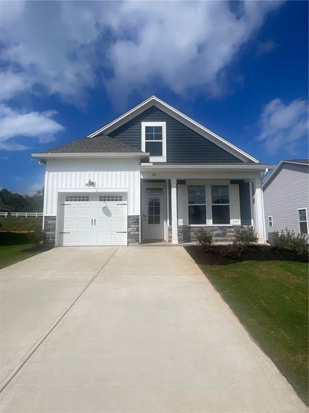 Front exterior of a new home in Springwood Grove, Central, SC, highlighting curb appeal (Image 1). Front exterior of a new home in Springwood Grove, Central, SC, highlighting curb appeal (Image 1).