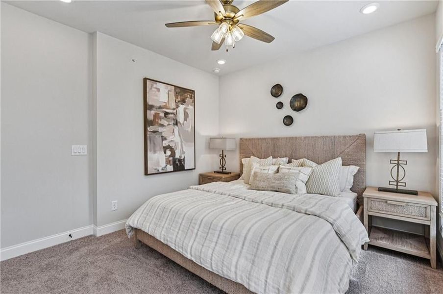 Bedroom with carpet, recessed lighting, and a ceiling fan