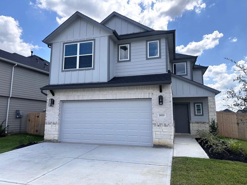 Front exterior of a new home in Grand Oaks Village, Houston, TX, highlighting curb appeal (Image 15). Front exterior of a new home in Grand Oaks Village, Houston, TX, highlighting curb appeal (Image 15).