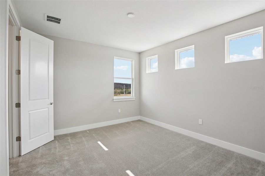 Spacious, unfurnished interior of a new home in Lagoon Residences at Epperson, Wesley Chapel (Image 24).