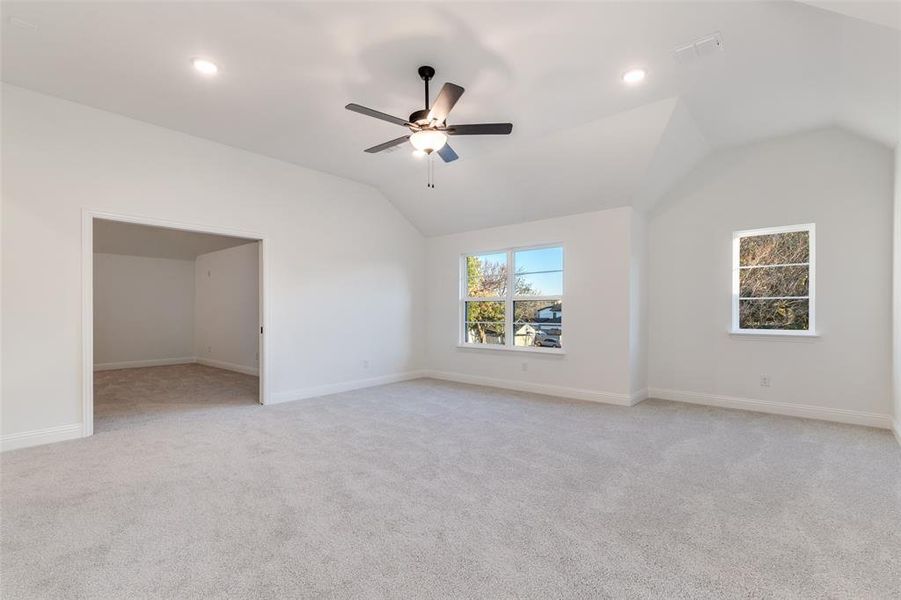 Bonus room with a vaulted ceiling, light colored carpet, and recessed lighting Bonus room with a vaulted ceiling, light colored carpet, and recessed lighting