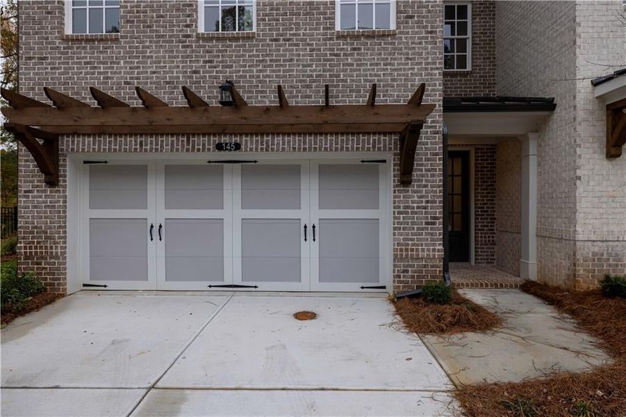 This plan features a two car front entry garage.*Please note photos shown are of the Ellington plan but not of the actual home.