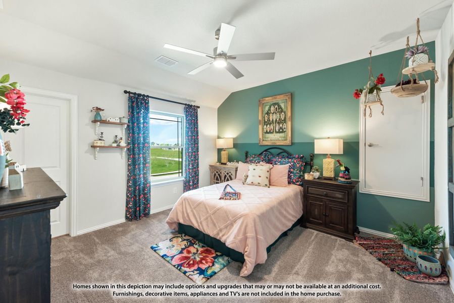 Bedroom with teal accent wall, ceiling fan, carpet flooring, and a window with floral curtains