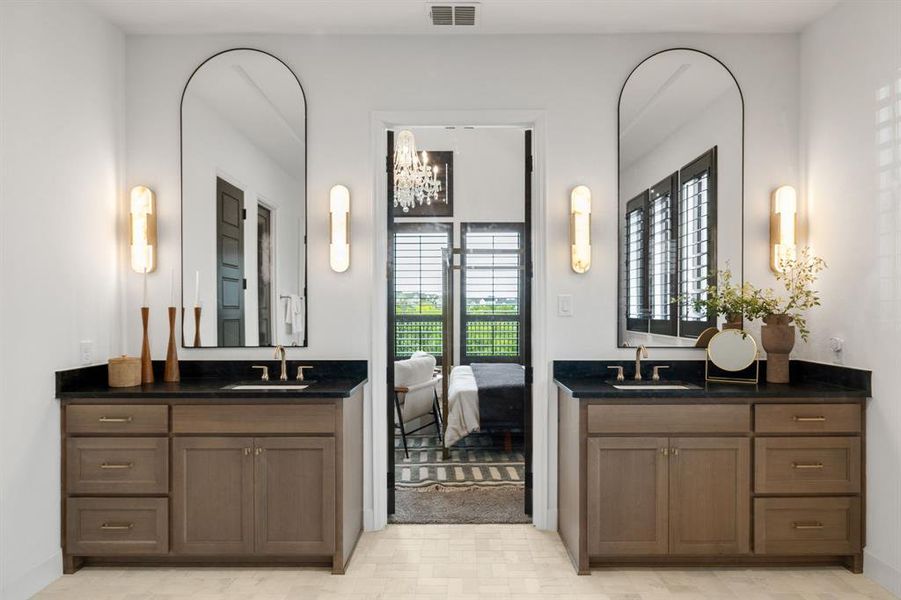Full bath featuring two vanities, a chandelier, and tile patterned floors Full bath featuring two vanities, a chandelier, and tile patterned floors