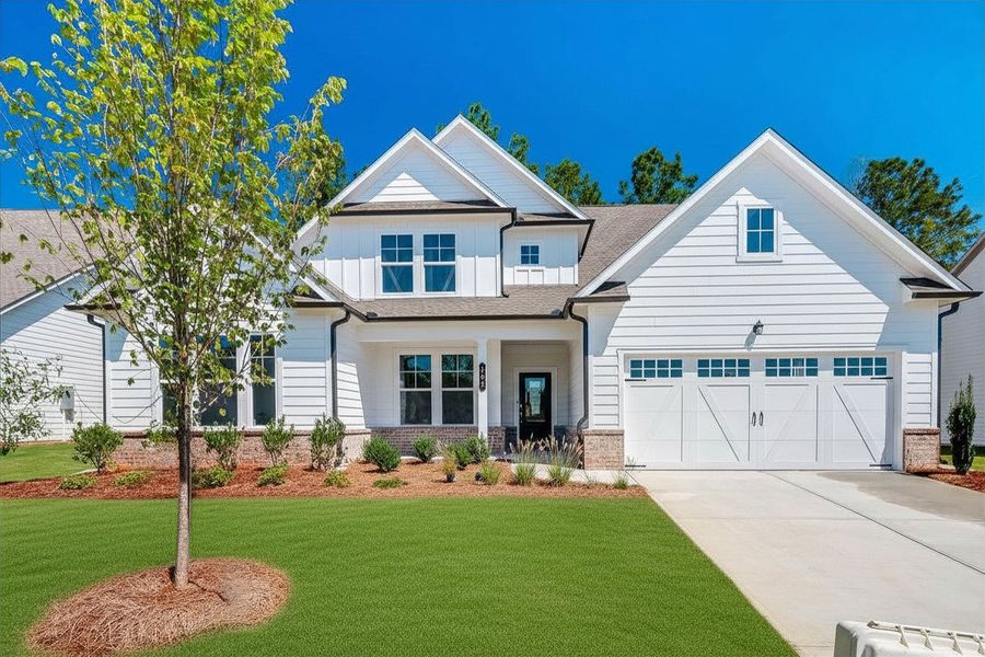 Front exterior of a new home in Twelve Parks 55+, Sharpsburg, GA, highlighting curb appeal (Image 1). Front exterior of a new home in Twelve Parks 55+, Sharpsburg, GA, highlighting curb appeal (Image 1).