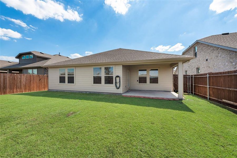 Single story home featuring concrete driveway, a yard, brick siding, a garage, and a shingled roof Single story home featuring concrete driveway, a yard, brick siding, a garage, and a shingled roof