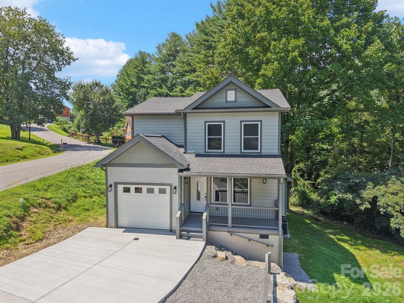 Front exterior of a new home in , Waynesville, NC, highlighting curb appeal (Image 29).