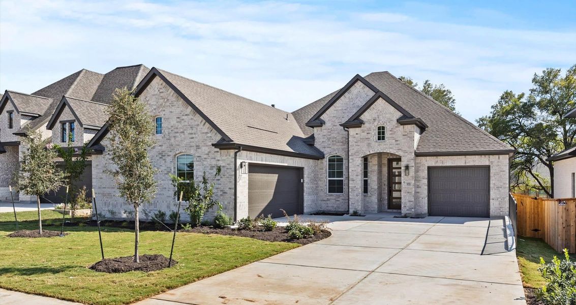 Front exterior of a new home in 6 Creeks, Kyle, TX, highlighting curb appeal (Image 1). Front exterior of a new home in 6 Creeks, Kyle, TX, highlighting curb appeal (Image 1).
