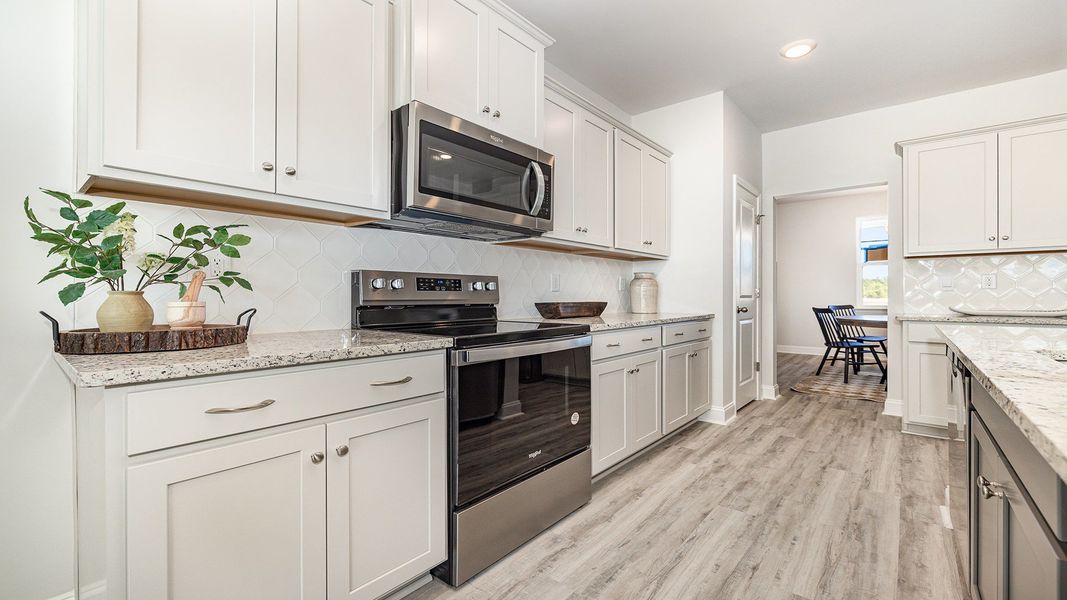 Representative furnished interior of a home built from the TILLMAN by D.R. Horton in Auberon Woods, Conway (Image 12).