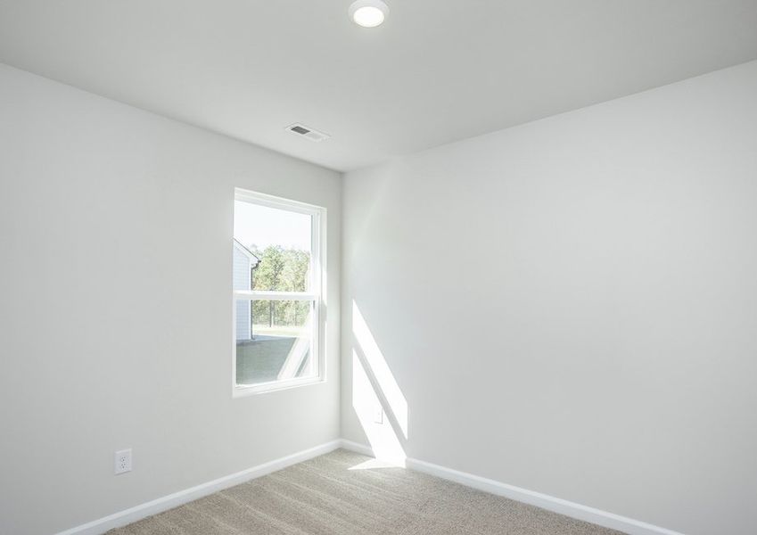 Secondary bedrooms are filled with natural light.