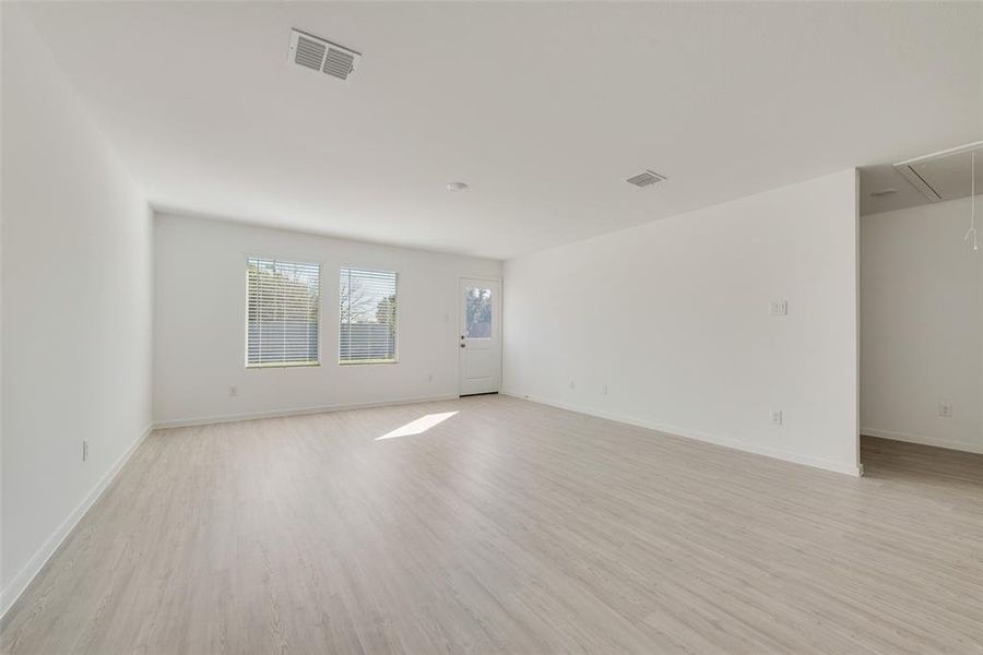 Spare room with light wood-type flooring