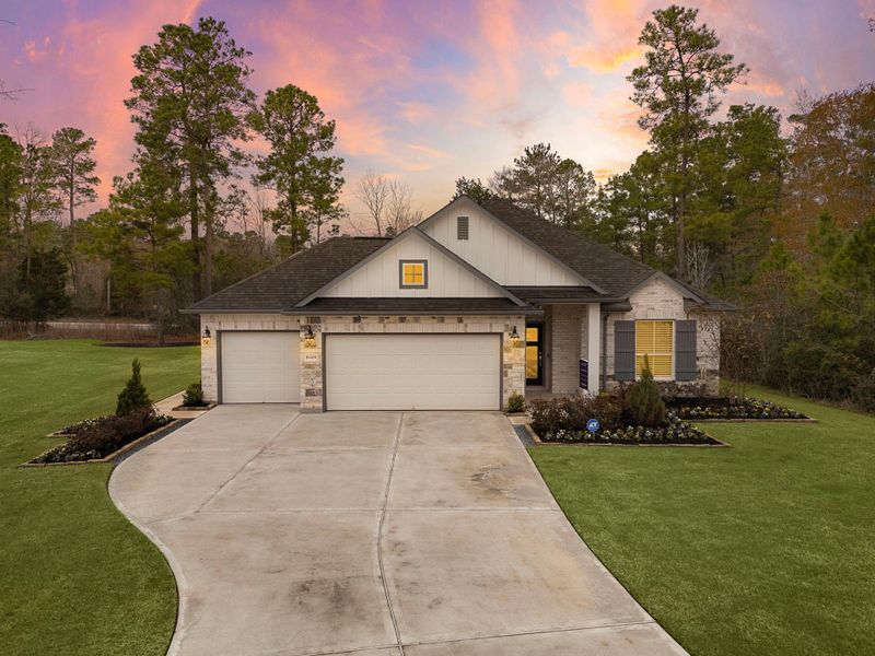 Front exterior of a new home in Oakwood Ranch, Willis, TX, highlighting curb appeal (Image 1). Front exterior of a new home in Oakwood Ranch, Willis, TX, highlighting curb appeal (Image 1).