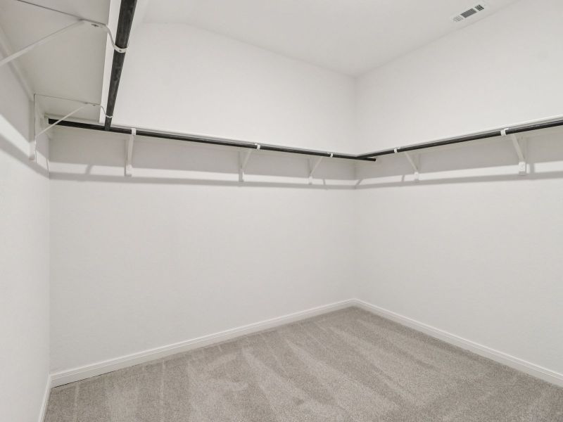 Primary suite walk-in closet in the Callaghan floorplan at a Meritage Homes community. Primary suite walk-in closet in the Callaghan floorplan at a Meritage Homes community.